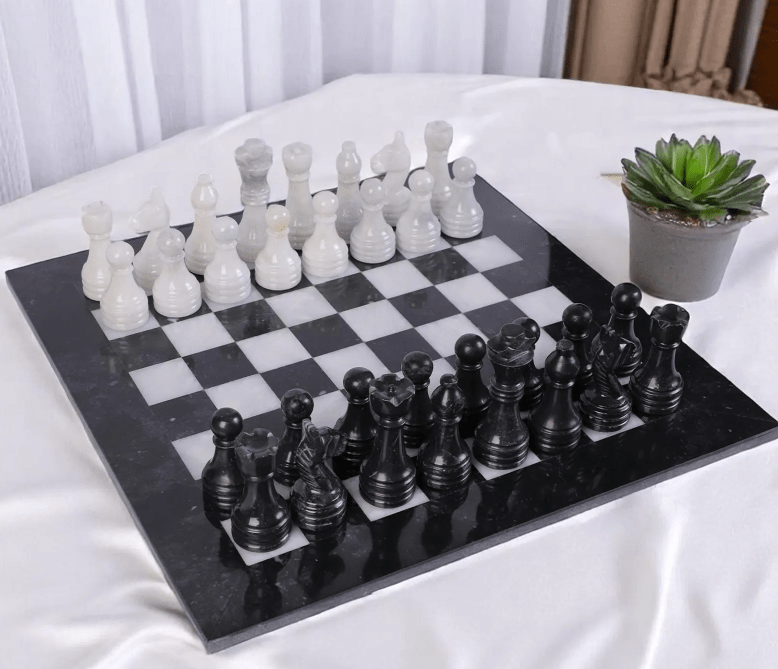 Handcrafted Black & White luxury marble chess set with black board and personalized engraving option.